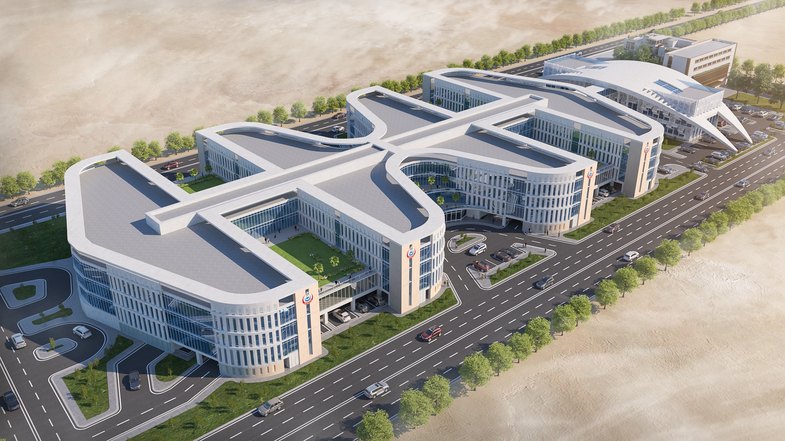 Architektonische Luftbildvisualisierung des Suez Medical Complex mit geschwungenen Gebäudeflügeln, begrünten Innenhöfen, Zufahrtsstraßen und einer breiten Hauptstraße.