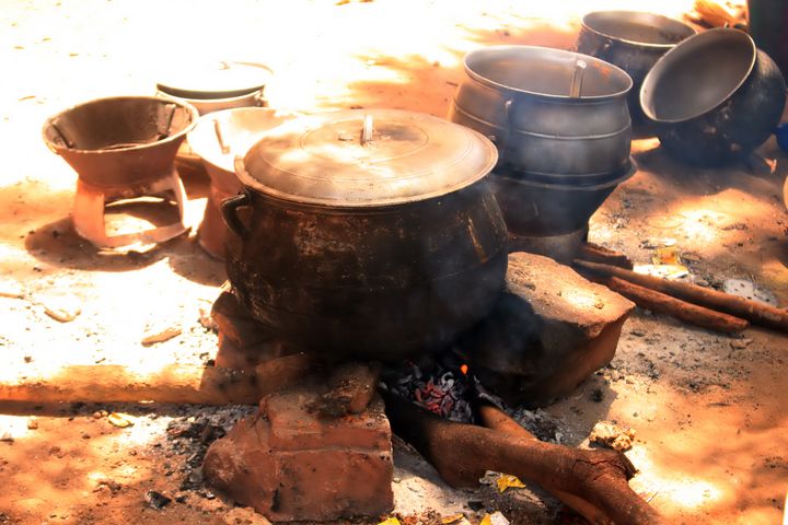 Big pots on a fire place.
