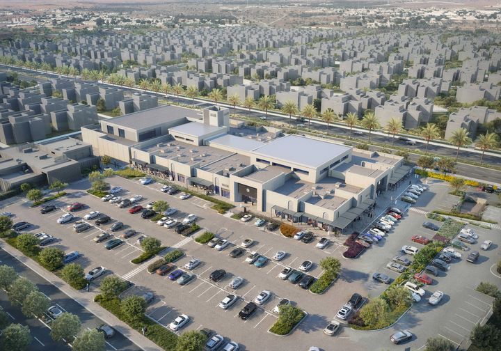 Architekturvisualisierung des Al Danah Square aus der Vogelperspektive, mit Geschäftsgebäuden, Parkplätzen und angrenzenden Wohnquartieren.