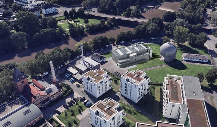 Luftbildmontage der geplanten PowerLahn-Anlage neben dem Kugelgasbehälter am Ufer der Lahn in Gießen.